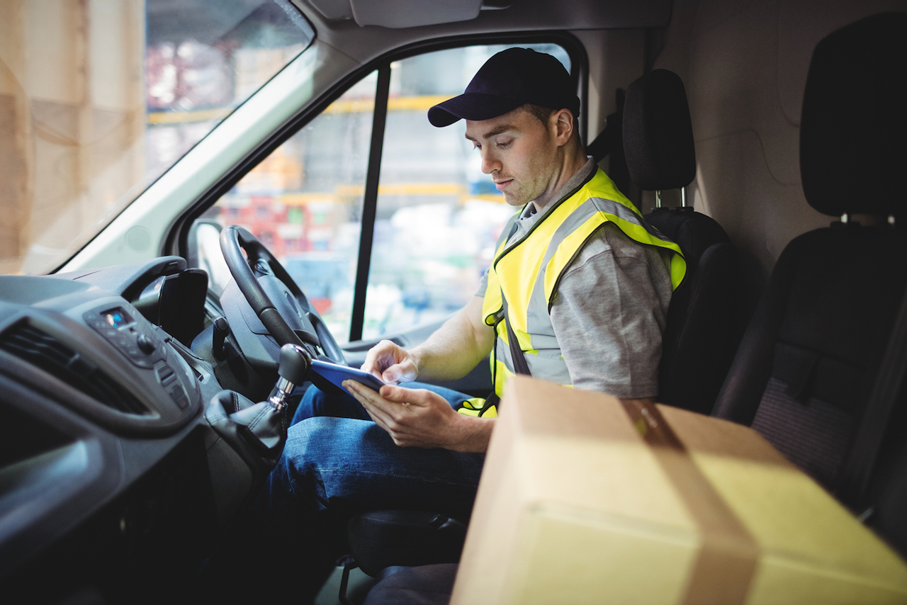 A van driver using his phone